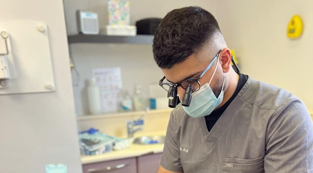 Dentist Dr. Asif at work.